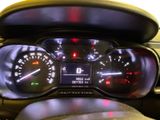 a close up of a car dashboard with a speedometer and gauges