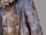 an image of a brown fur coat with a plaid collar