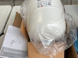 a box with a large white object in it sitting on a table