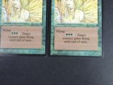 two cards that are sitting on a table