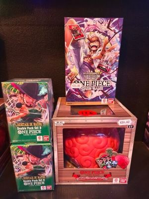 two boxes of card games are sitting on a table next to each other