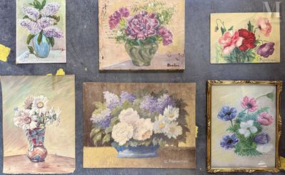 many paintings of flowers in a vase on the wall