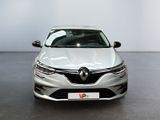 the front view of a white car parked in a showroom
