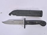 two knives that are laying next to each other on a table