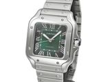 an image of a wrist watch with a green dial