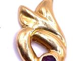 an image of a gold plated pendant with a purple stone