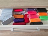 a drawer with many different colored items in it