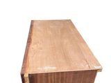 an old wooden box sitting on top of a white surface