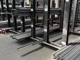 many different types of steel bars in a warehouse