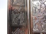 a silver case with a picture of people and animals on it