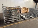 many racks that are stacked up in a warehouse