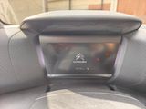 a close up of a car ' s dashboard with a remote control