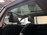 a view of a car ' s sunroof from the inside