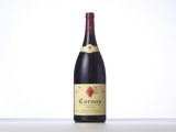 a bottle of red wine sitting on top of a table
