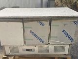two refrigerators stacked on top of each other on a pallet