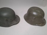 two helmets are sitting next to each other on a table