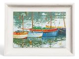 three boats that are sitting in the water