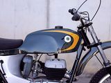 a motorcycle that is parked in front of a wall