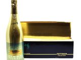 a close up of a bottle of champagne next to a box