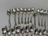 a lot of spoons and spoon spoons on the table