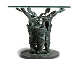 an image of a table with a glass top and a statue on it
