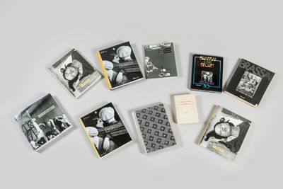 a lot of books that are on a table