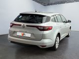 a picture of a silver car parked in a garage