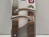a metal door handle on a card holder on a table