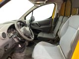 a small yellow van with a steering wheel and a dashboard