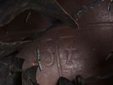 a close up view of a leather shoe with a tag on it