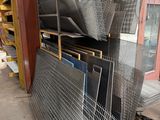 many pieces of metal on the floor in the warehouse