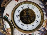 a close up of a clock on a table
