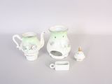 a small tea pot and a small tea pot on a table