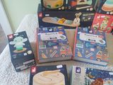 a lot of toys that are sitting on a bed