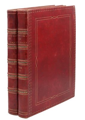un livre en cuir rouge à deux dos, orné d'une bordure dorée