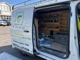the back of a van with the door open and the door open