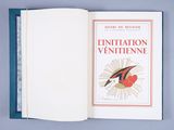 an open book with a picture of a bird on top of it