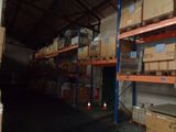 many boxes on the shelves in the warehouse