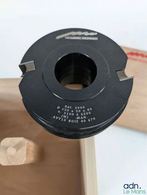 a close up of a piece of wood with a hole in it