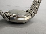 a close up of a watch on a table