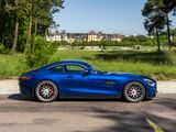 a blue sports car parked on the side of the road