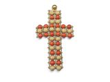 a close up of a cross made of beads on a white background