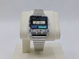 a digital watch on a stand on a white surface
