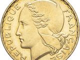 gros plan d'une pièce de monnaie sur laquelle figure un visage de femme