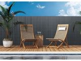 a pair of chairs sitting on top of a wooden deck next to a pool