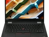 a laptop with a black keyboard sitting on top of a white surface