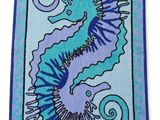 a blue and purple rug with a seahorse on it