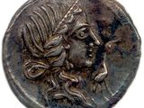 une pièce de monnaie en argent portant un visage de femme