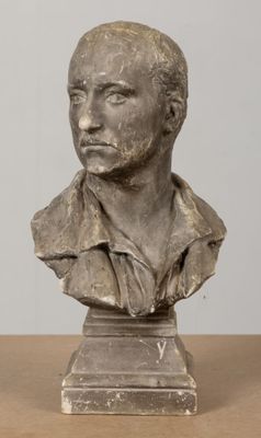an image of a bust of a man on a wooden table