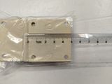 a ruler and a piece of plastic sitting on a table